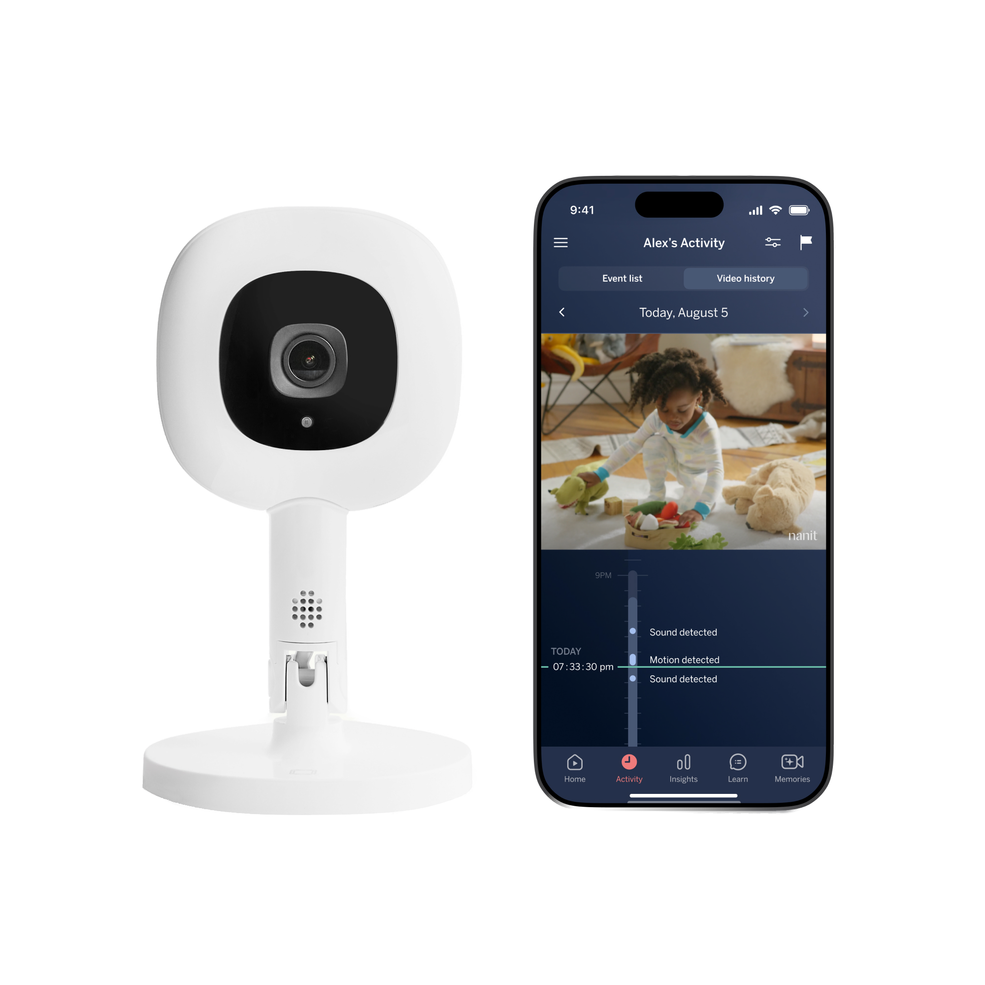 Official Nanit image showing the Essential camera on its portable Anywhere Stand beside a phone displaying the Nanit app.
